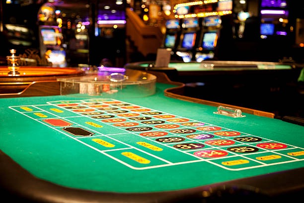 Croupier dealing blackjack cards in a live studio setup